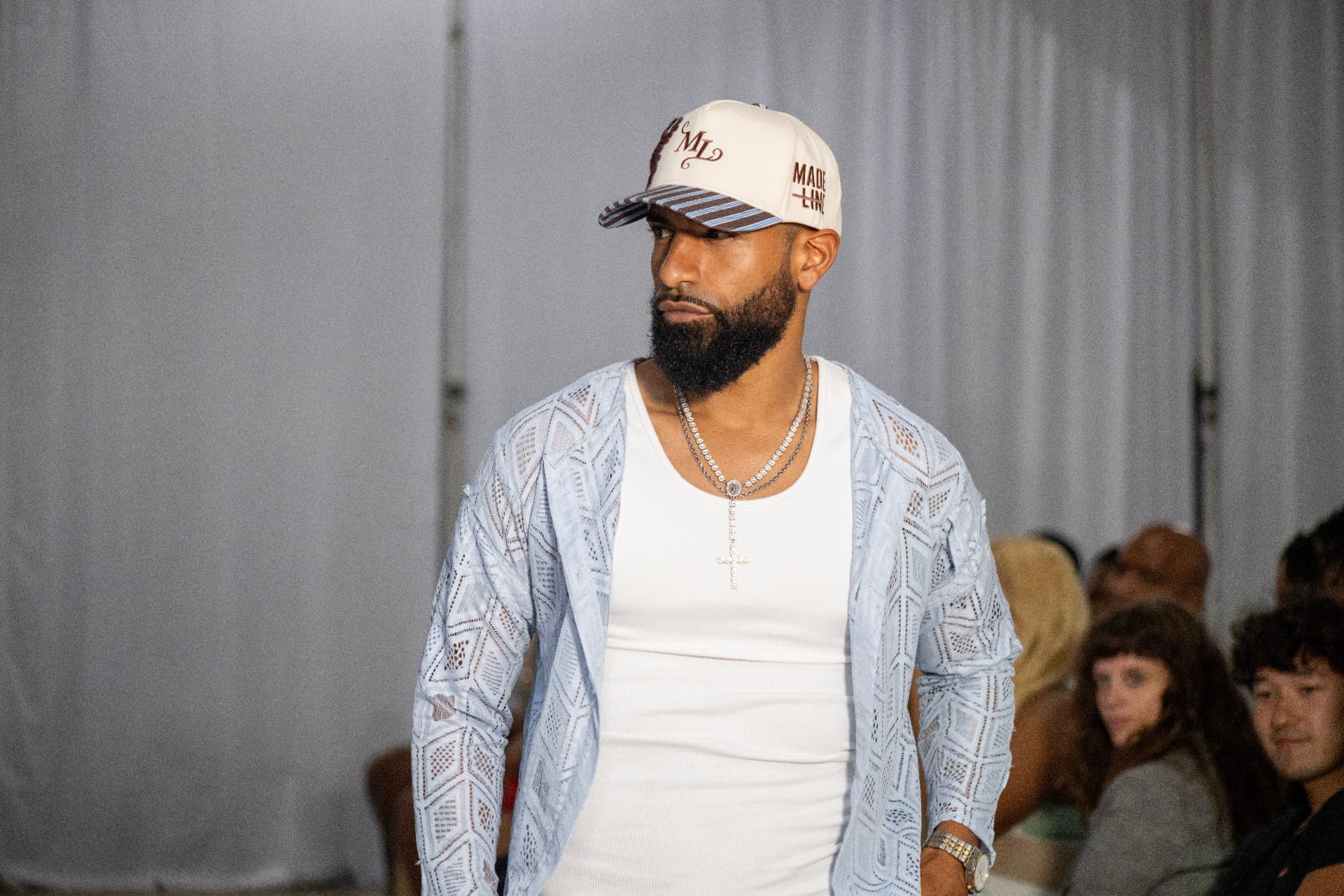 Runway — lace overshirt and cross chain