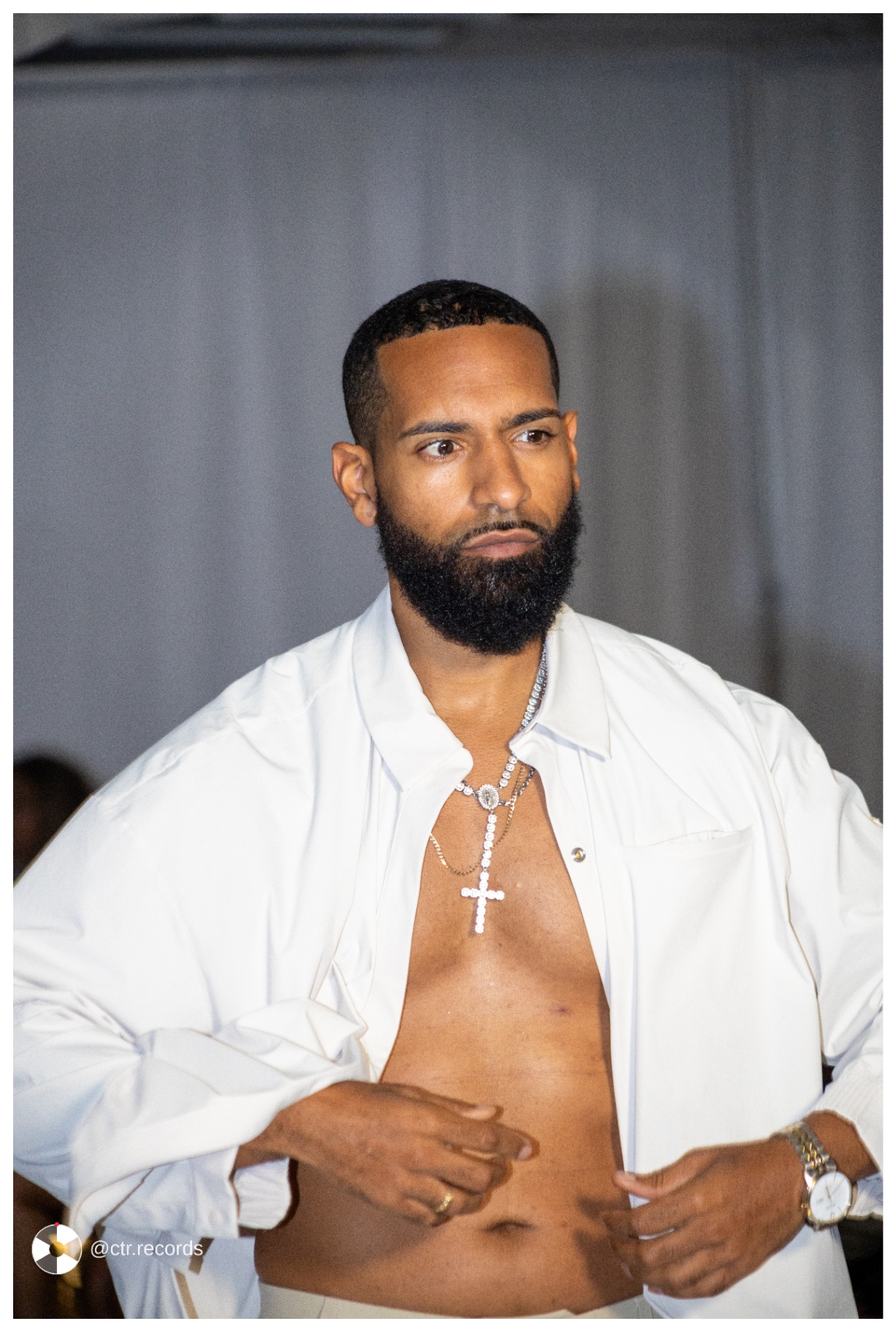 Runway — white shirt, diamond cross