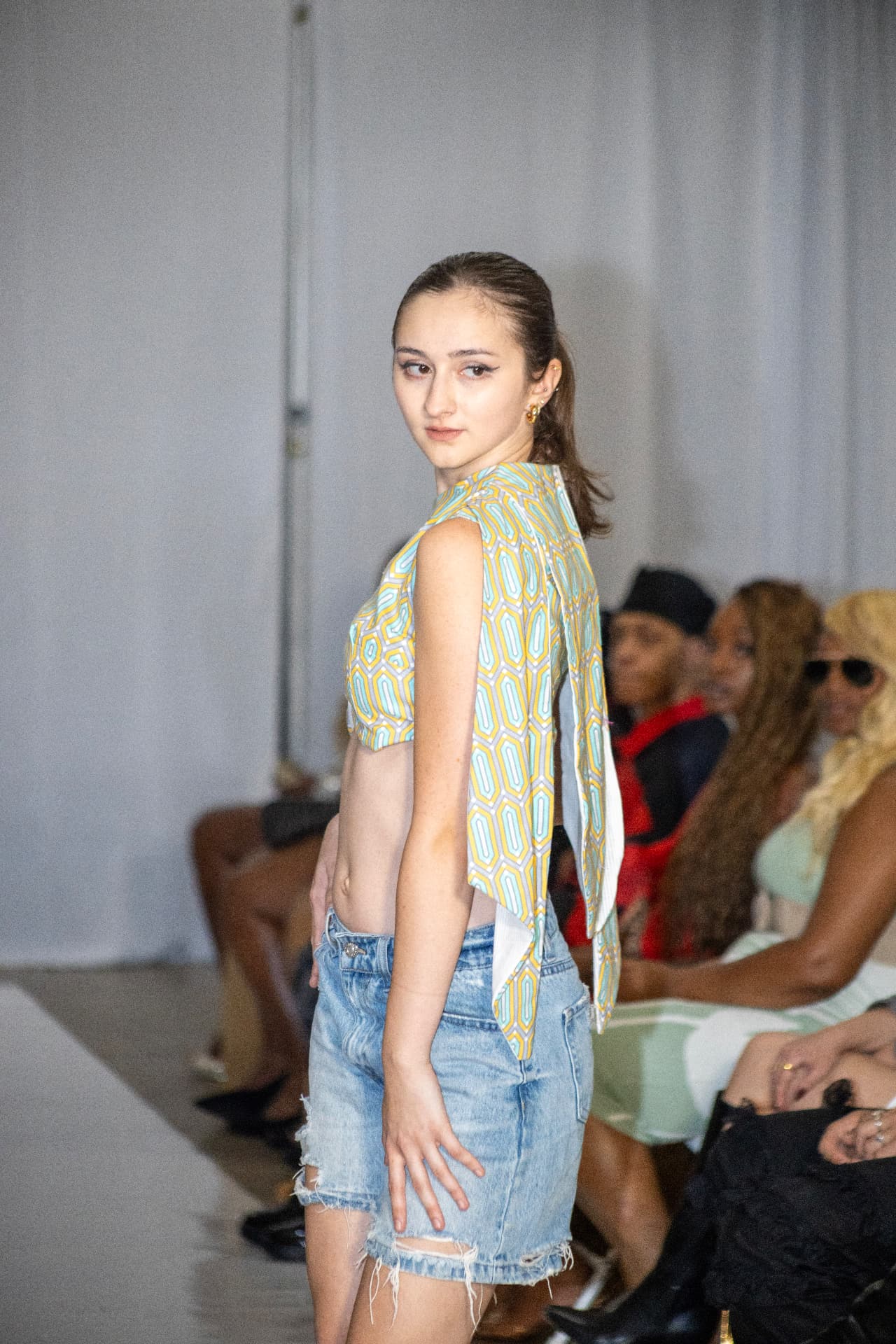 Runway — geometric print drape, denim shorts