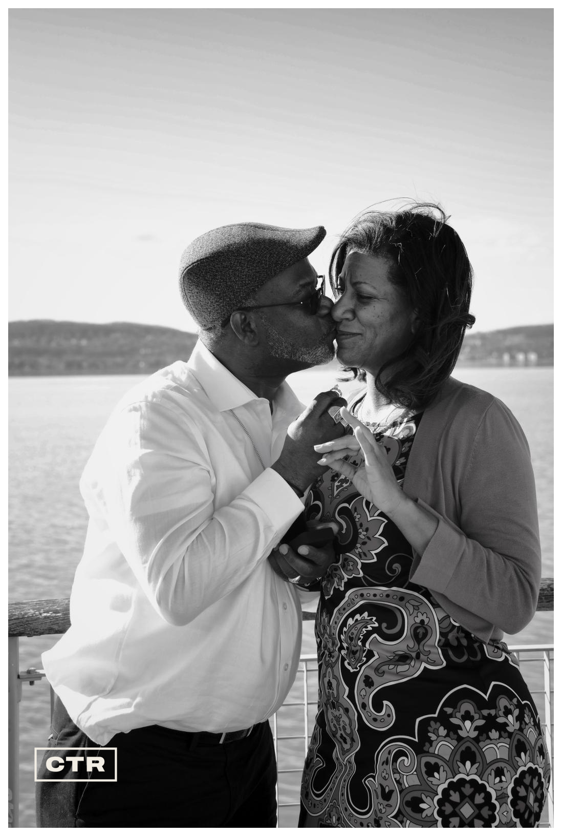 Couple portrait — a waterfront kiss