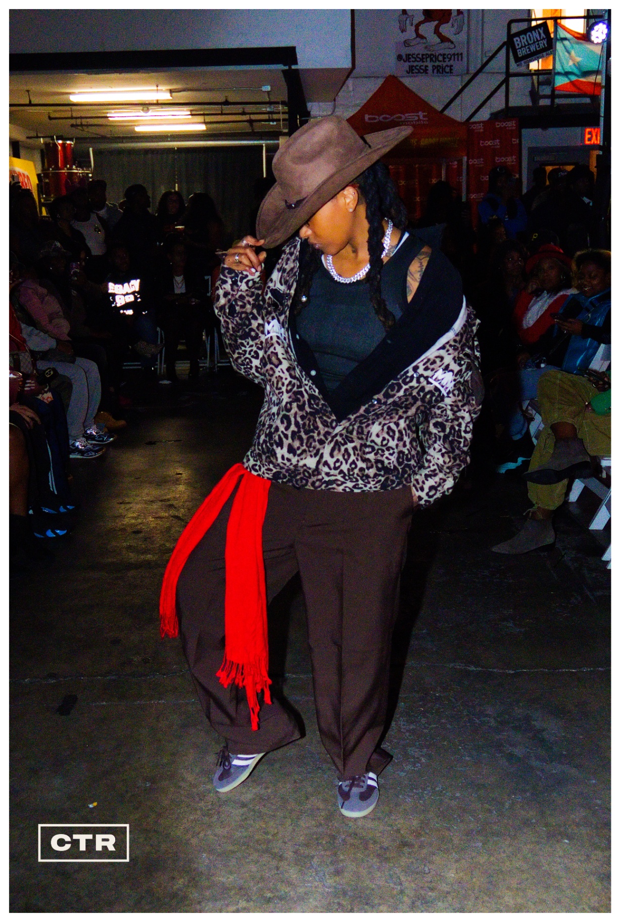 Runway — leopard jacket, cowboy hat, red sash