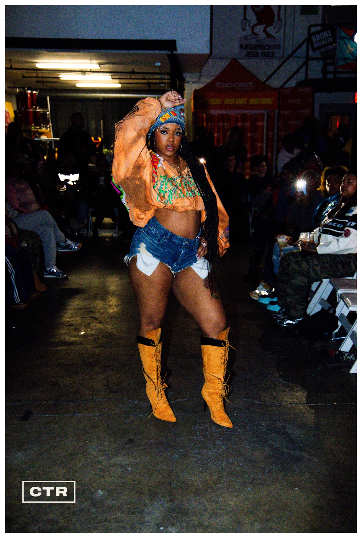 Runway — cropped jacket, denim shorts, tan boots